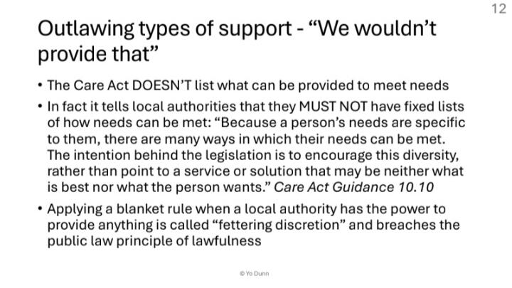 https://affecttheverb.com/disabledandhere A slightly overhead perspective of two disabled Black people holding hands while sitting across from each other at a cafe.